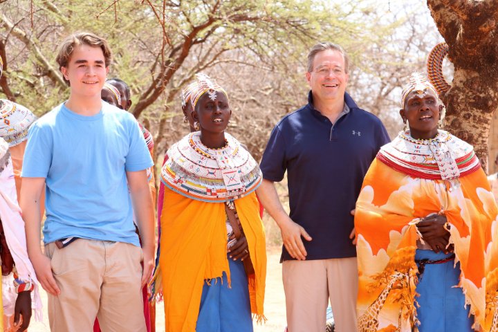 Matthias Ehrhardt and his son with Maasai women in Kenya